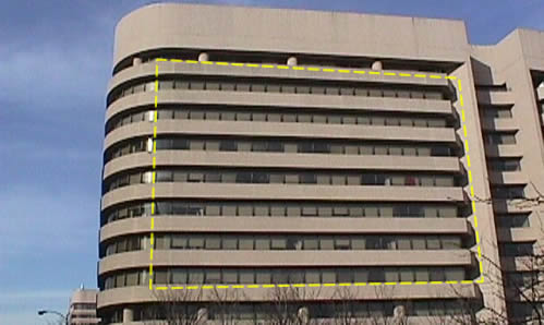 Exterior view of high-rise office building with windows mostly shaded